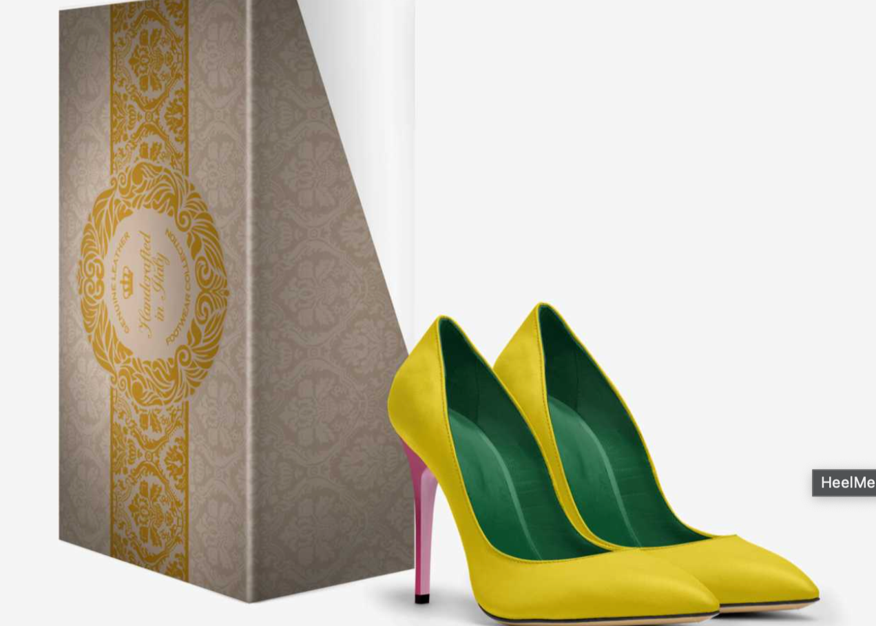 Yellow high-heeled shoes with green soles next to a decorative box on a white background
