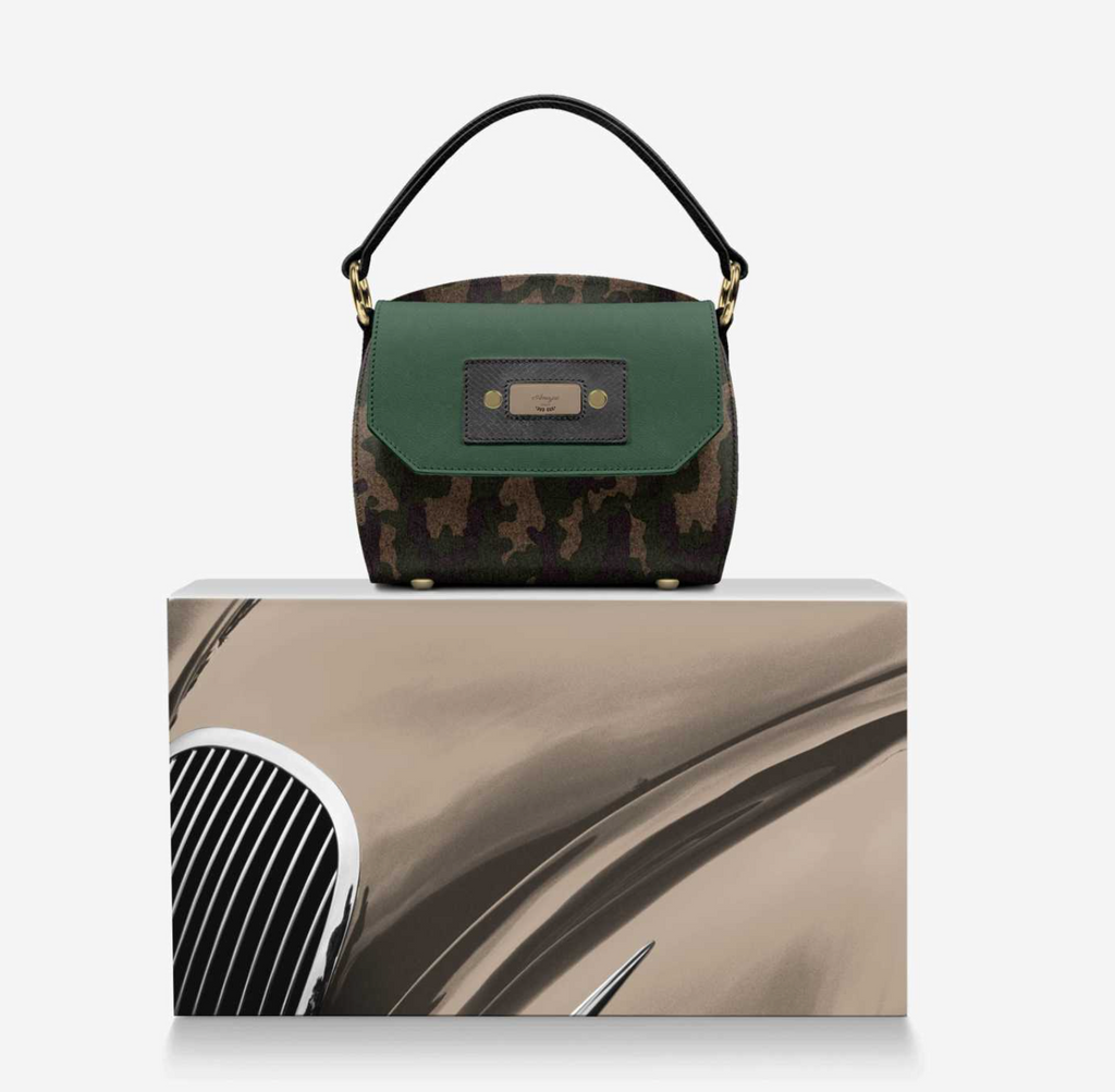 CamoFlyy-E front view on box - 3D raised camo body, dark green suede flap, black handle, gold feet